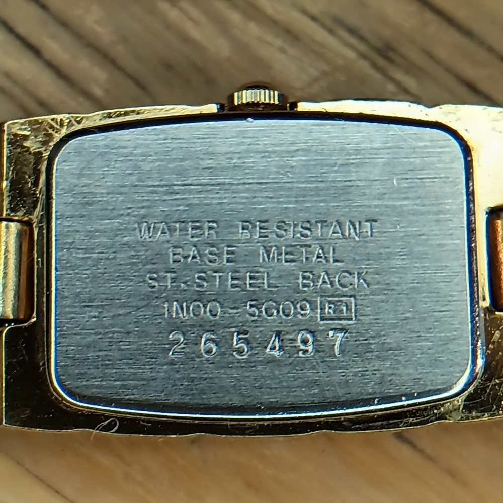 Seiko Ladies Black dial, 2 hand movement gold case and bracelet w/diamond at 12 - Picture 6 of 10
